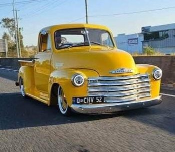 52 Chevy 3100 pick-up truck driving on road