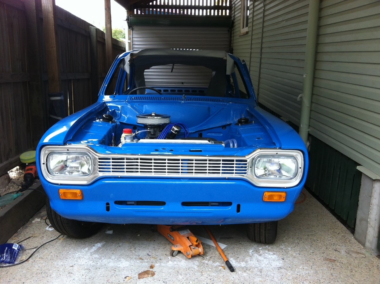 Laid up blue 1975 Ford Mk 1 Escort Coupe facing the front